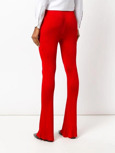 Shop Givenchy Flared Ribbed Trousers In Red