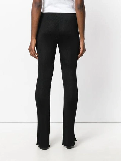 Shop Givenchy Flared Ribbed Trousers - Black