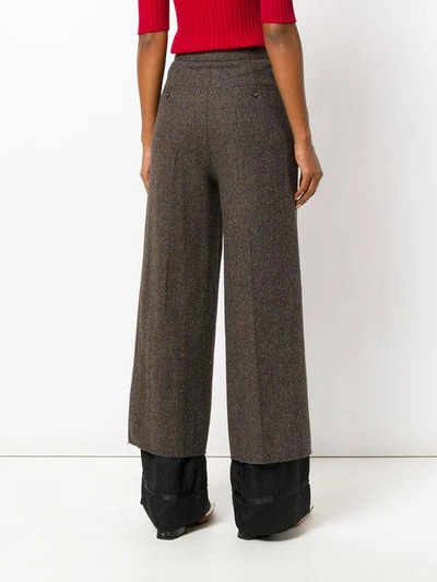 Shop Maison Margiela Flared Wool Trousers - Brown