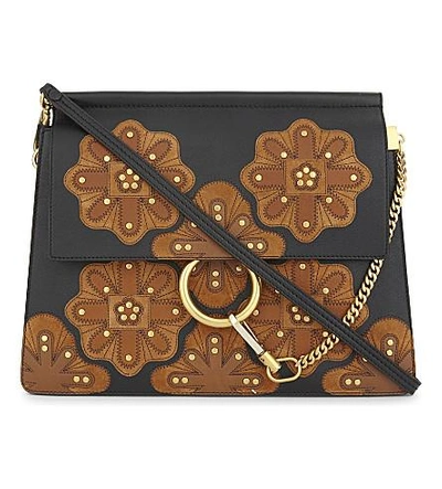 Shop Chloé Faye Stud-flower Medium Leather Cross-body Bag In Black Tan