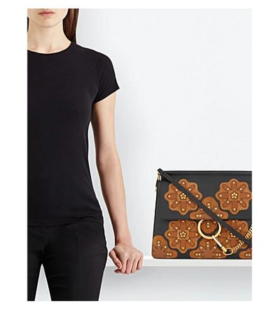 Shop Chloé Faye Stud-flower Medium Leather Cross-body Bag In Black Tan