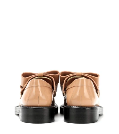 Shop Marni Glossed-leather Loafers In Beige