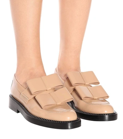 Shop Marni Glossed-leather Loafers In Beige