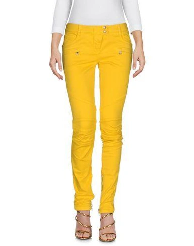 Shop Balmain Jeans In Yellow