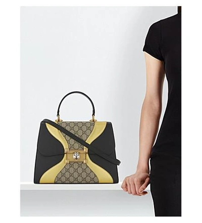 Shop Gucci Osiride Leather Top Handle Bag In Black Gold