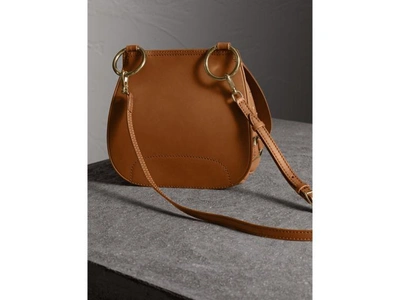 Shop Burberry The Bridle Bag In Leather And Rivets In Tan