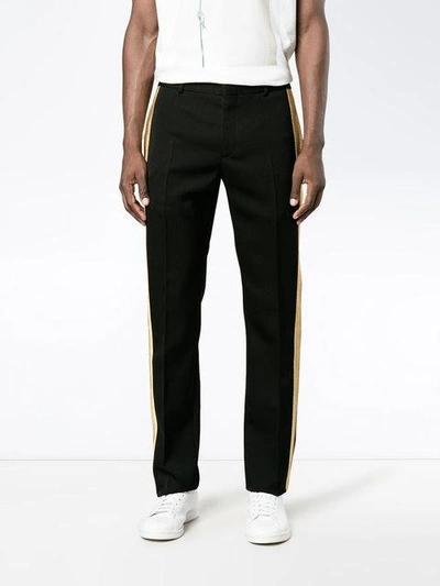 Shop Alexander Mcqueen Gold Stripe Straight Leg Black Trousers In 1000black