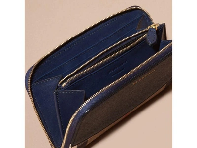 Shop Burberry House Check And Leather Ziparound Wallet In Ink Blue