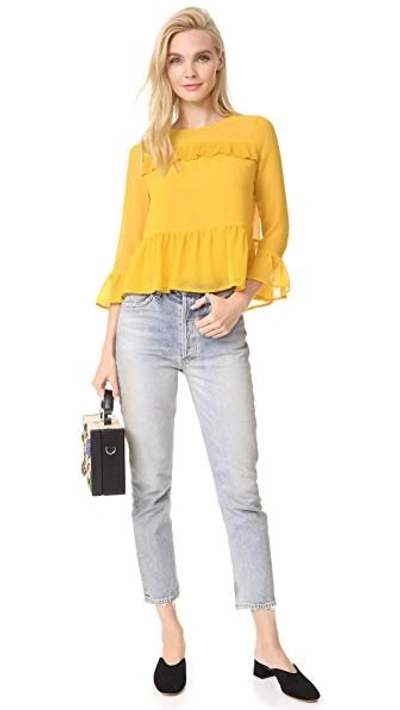 Shop Cupcakes And Cashmere Katlyn Peplum Blouse In Saffron Yellow