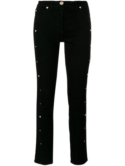 Shop Versace Medusa Stud Cropped Jeans - Black