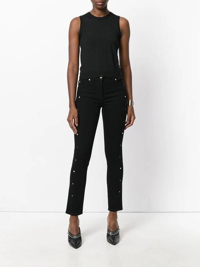 Shop Versace Medusa Stud Cropped Jeans - Black