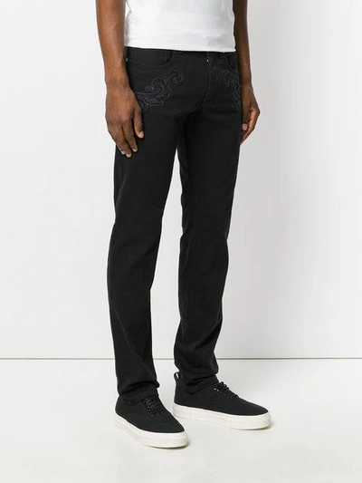 Shop Versace Slim Fit Denim Jeans In Black