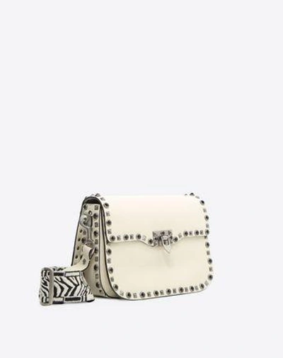 Shop Valentino Rockstud Bag In Ivory