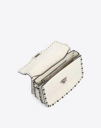 Shop Valentino Rockstud Bag In Ivory