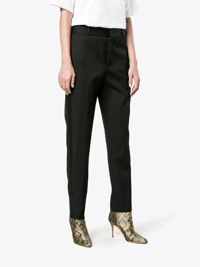 Shop Saint Laurent Satin Stripe Suit Trousers In Black