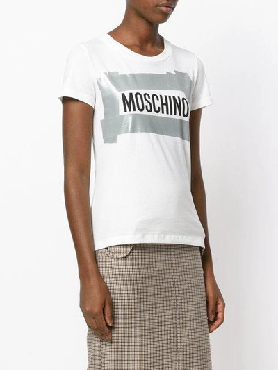 Shop Moschino Duct Tape Logo T-shirt In White