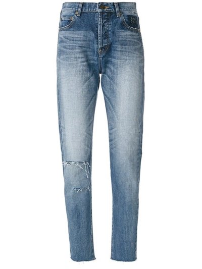 Shop Saint Laurent Distressed Tapered Fit Jeans In Blue