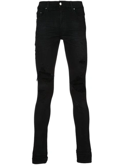 Shop Amiri - Distressed Skinny Jeans  In Black