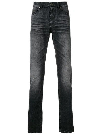 Shop Saint Laurent Straight Leg Jeans In Black