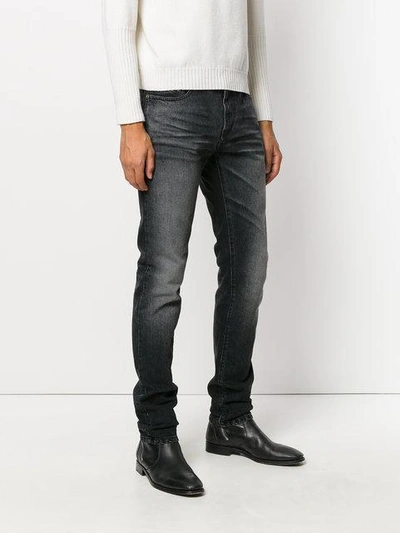 Shop Saint Laurent Straight Leg Jeans In Black