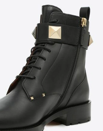 Shop Valentino Combat Boot In Black