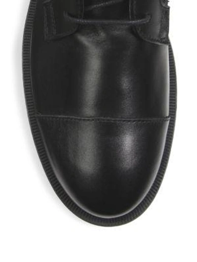 Shop Tod's Buckle Combat Boots In Black