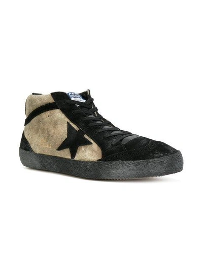 Shop Golden Goose Mid Star Sneakers