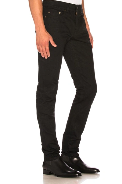 Shop Saint Laurent Low Rise Skinny Jeans In Black