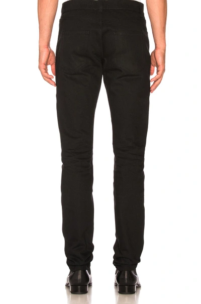 Shop Saint Laurent Low Rise Skinny Jeans In Black