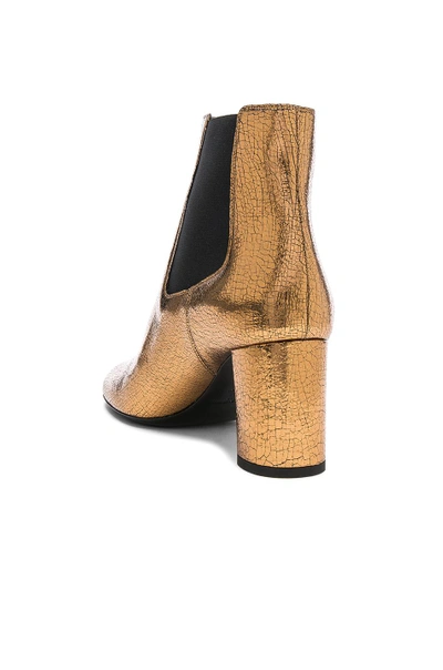 Shop Saint Laurent Cracked Metallic Leather Loulou Pin Boots In Metallics