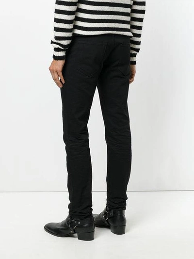 Shop Saint Laurent Classic Fitted Skinny Jeans - Black