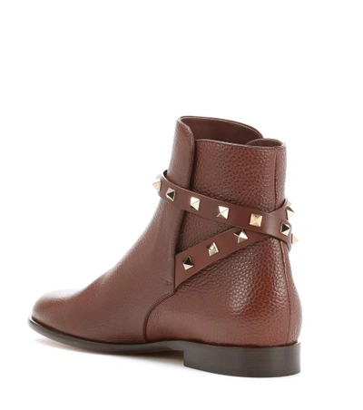 Shop Valentino Rockstud Leather Boots In Brown