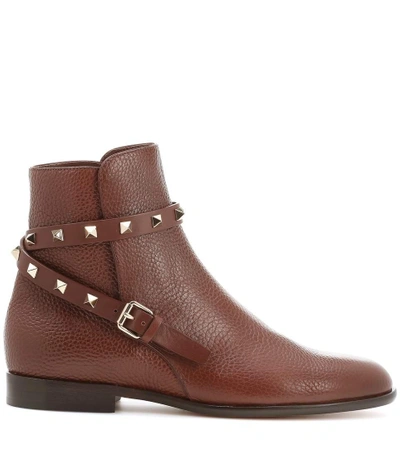 Shop Valentino Rockstud Leather Boots In Brown
