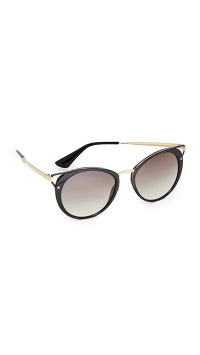 Shop Prada Wanderer Sunglasses In Black/grey