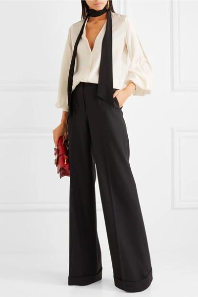 Shop Dolce & Gabbana Stretch Wool-blend Flared Pants In Black