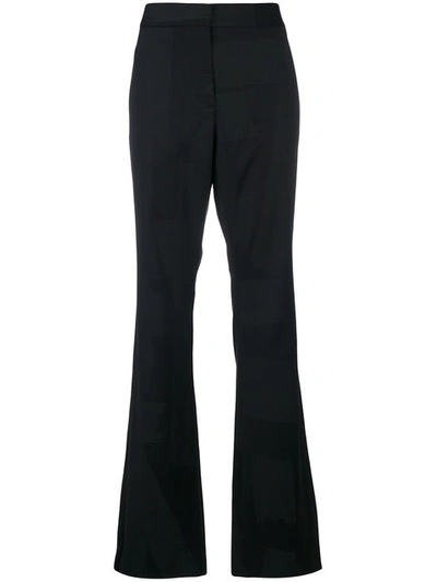 Moschino Flared Tailored Trousers In Black