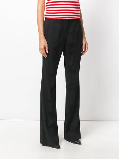 Shop Moschino Flared Tailored Trousers