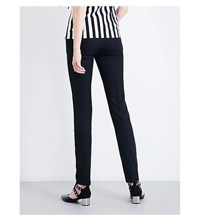 Shop Monse Tailored-fit Mid-rise Wool-blend Pants In Black