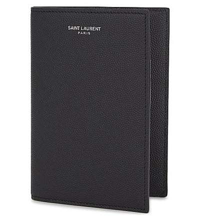 Shop Saint Laurent Pebbled Leather Passport Wallet In Black