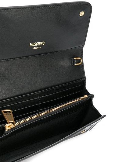 Shop Moschino Printed Logo Clutch Bag In 3055