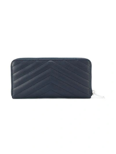 Shop Saint Laurent Monogram Zip Around Wallet In Blue