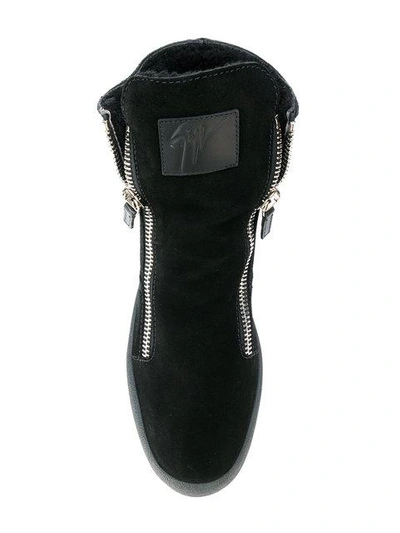 Shop Giuseppe Zanotti Shearling Lined Hi-top Sneakers In Black