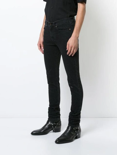 Shop Saint Laurent Skinny Worn Denim Jeans