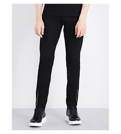 Alexander Mcqueen Zipped-cuffs Slim-fit Tapered Jeans In Black/black