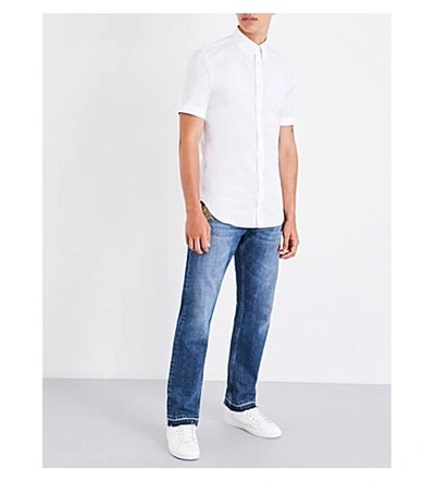 Shop Alexander Mcqueen Embroidered-detail Regular-fit Straight Jeans In Blue Stonewashed