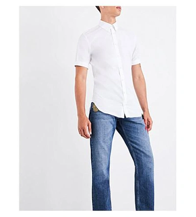 Shop Alexander Mcqueen Embroidered-detail Regular-fit Straight Jeans In Blue Stonewashed