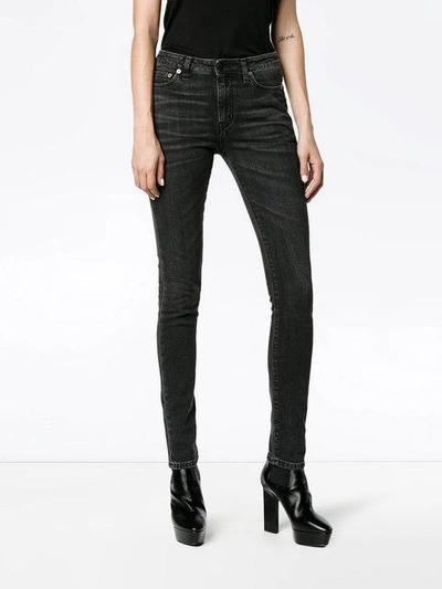 Shop Saint Laurent Washed Black Mid Rise Skinny Jeans