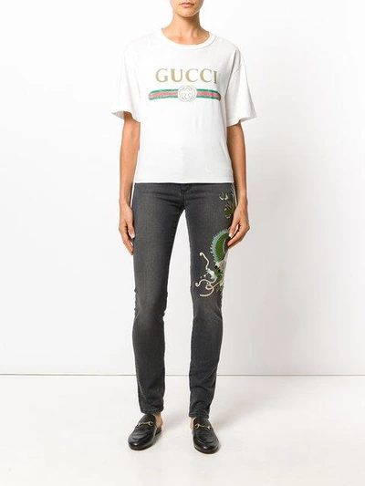 Shop Gucci Skinny Dragon Jeans