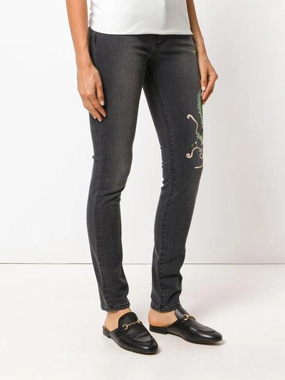 Shop Gucci Skinny Dragon Jeans