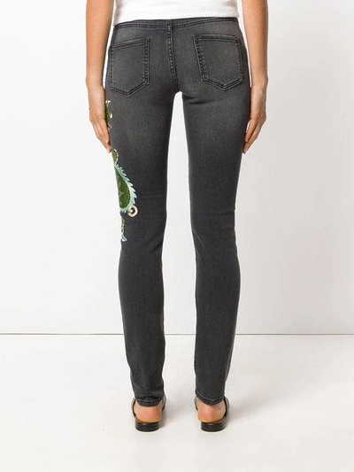 Shop Gucci Skinny Dragon Jeans